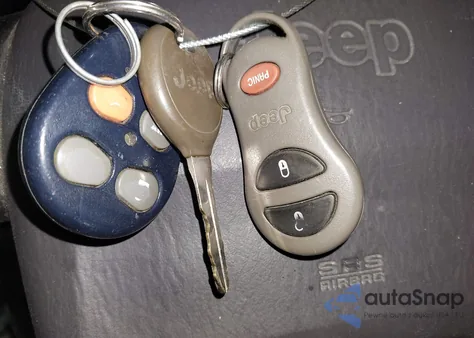 1999 Jeep Grand Cherokee Laredo из США, поврежденный, VIN 1J4GW58S1XC779363